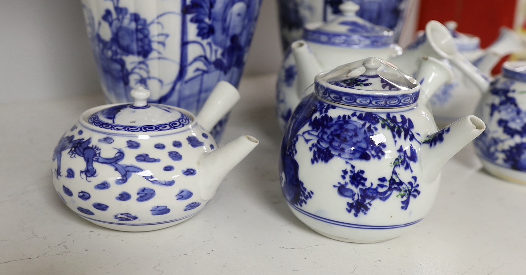 A pair of Japanese blue and white vases and various Japanese blue and white porcelain teapots and covers, tallest 30cm